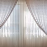 Choose curtains or drapes with distinctive prints to add an element of visual interest to the windows and complete the room's decor.