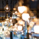 Light the entire bathroom evenly using a central ceiling light, complemented by recessed spotlights or wall lights in the mirror area.