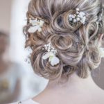 Romantic hairstyles for brides: loose curls, braids, sophisticated buns.